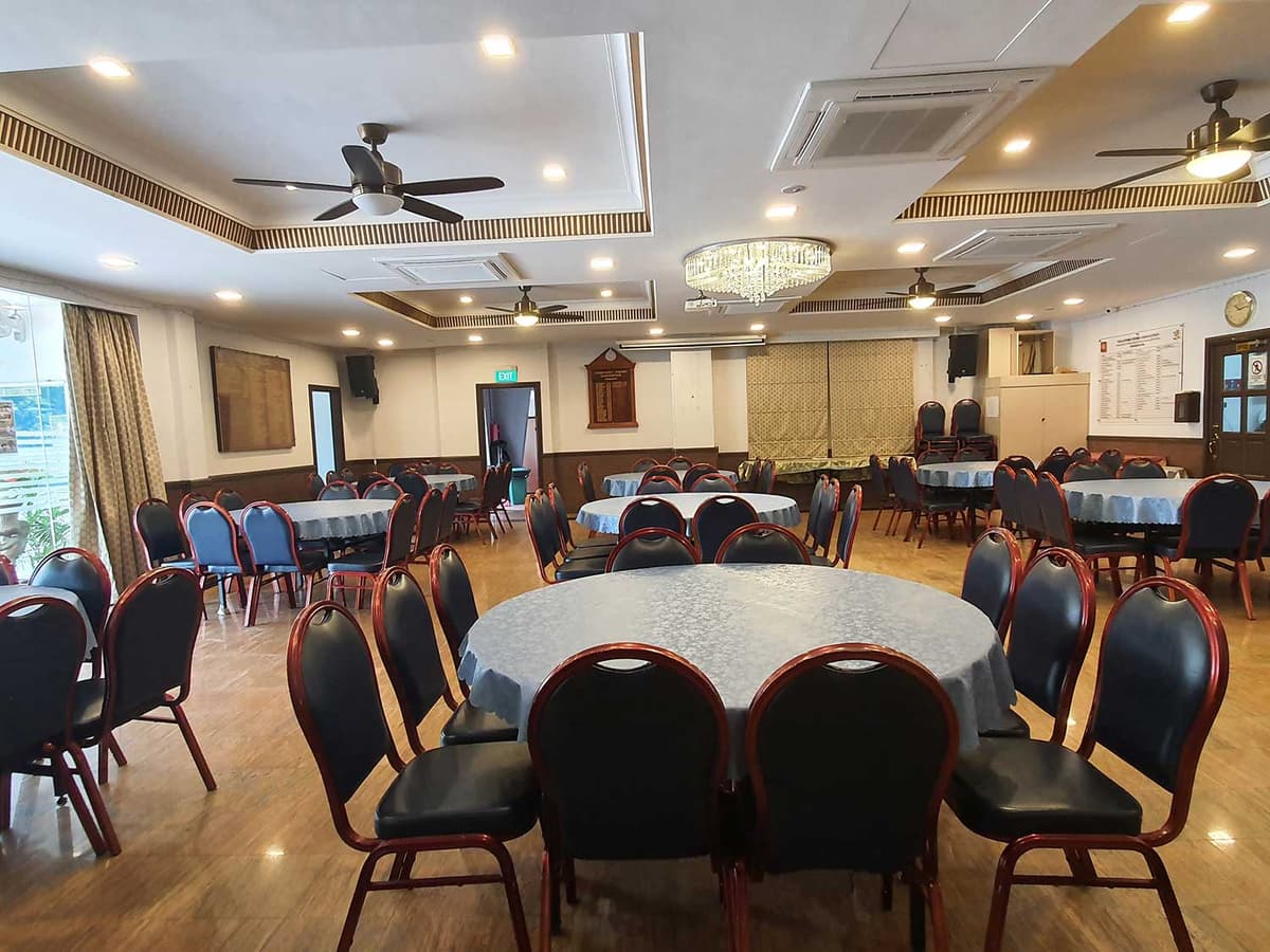 The Main Hall at Sindhu House, laid out with round banquet tables